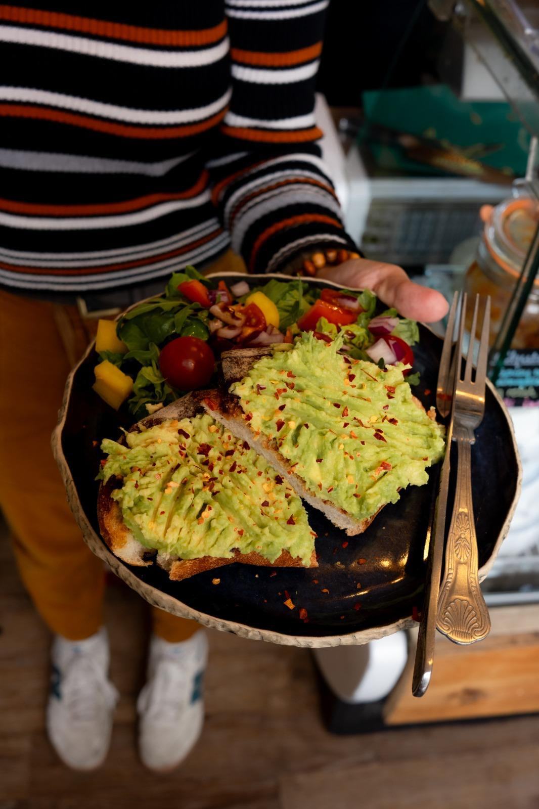 Avocado toast with side salad at Books N' Cup Tollcross