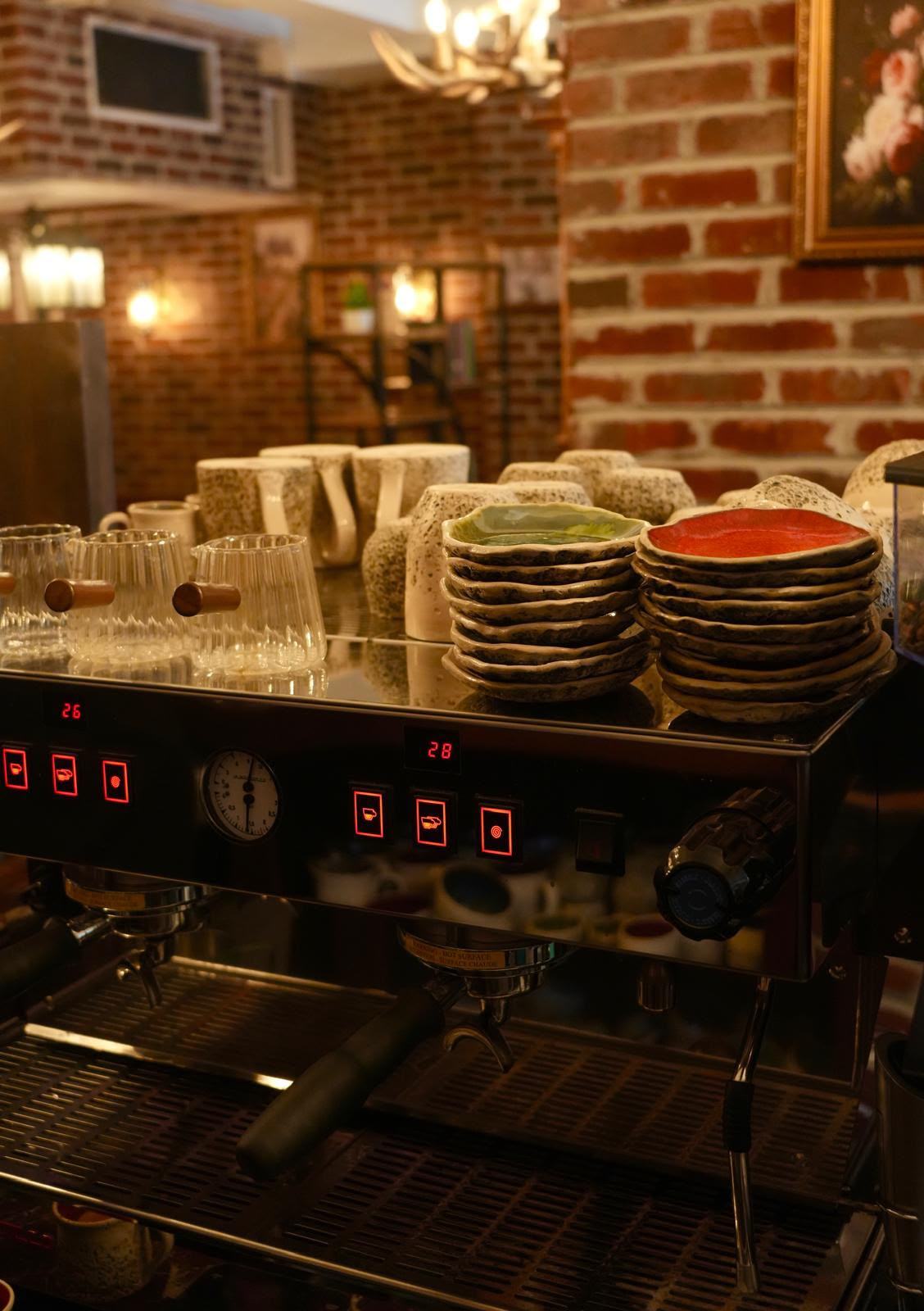 Espresso machine and ceramic cups at Books N' Cup Manhattan