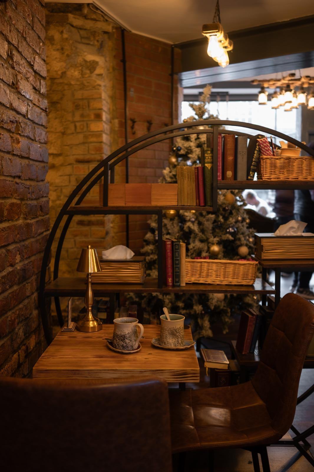 Arched bookshelf seating nook at Books N' Cup Stockbridge